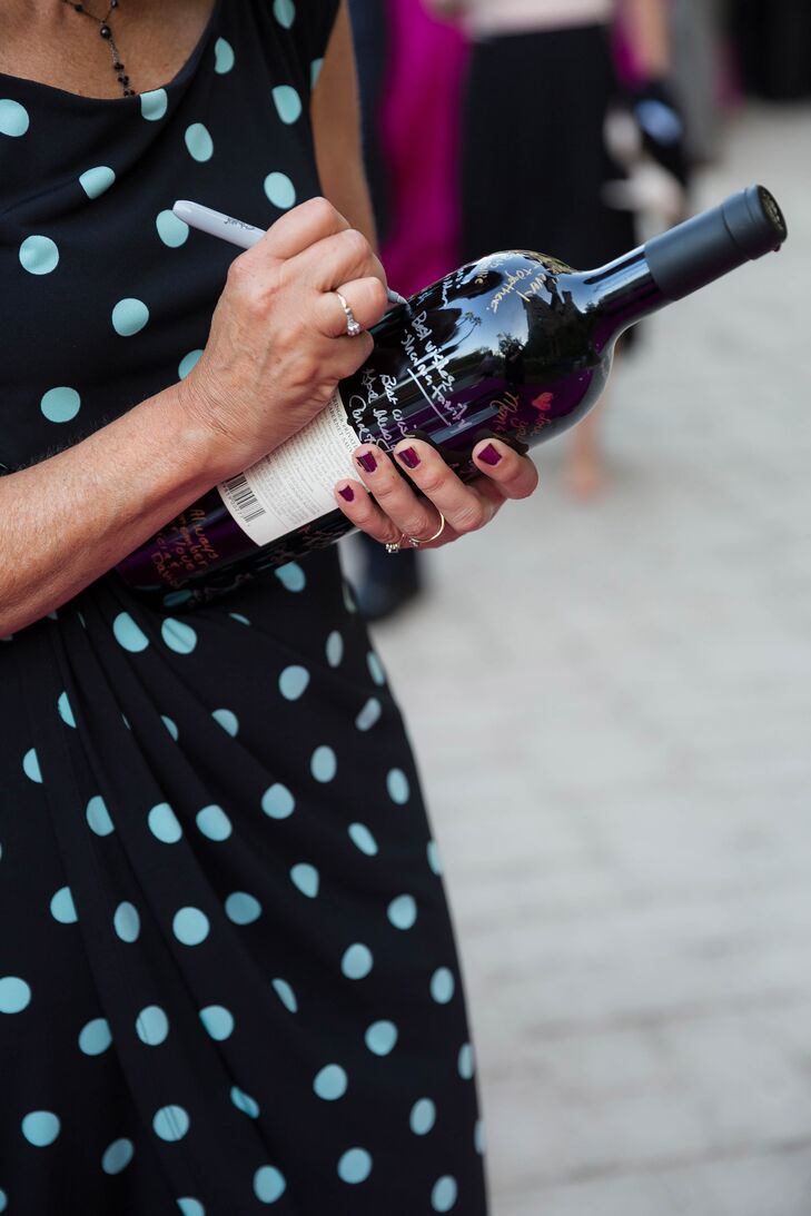 Guests signed a wine bottle for the couple's unique guest book.