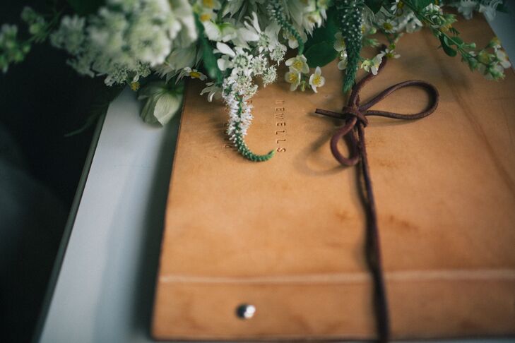 Friends and family left notes and advice in a leather-bound book.