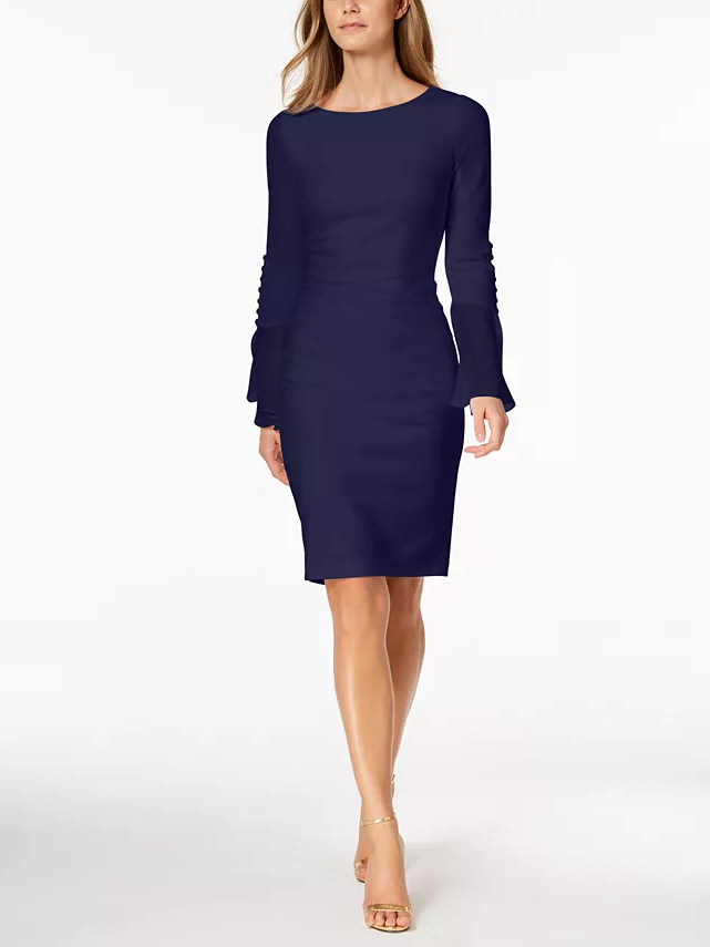A model shows off this flattering modern sheath dress with long sleeves.