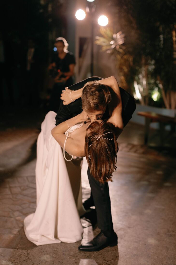 Groom Dipping Bride With Pearl Headband, Short Hairstyle in a Kiss During First Dance