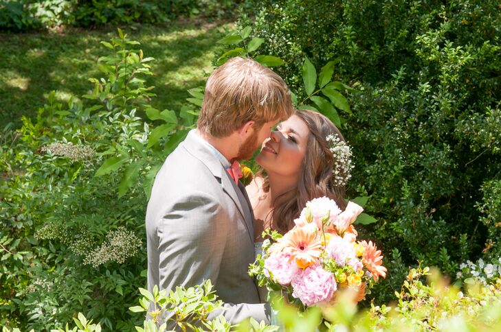 When Candace couldn’t find flower arrangements she liked—aside from her gorgeous bouquet—she took it upon herself to make them. Her accessory was no exception. After her hair was styled into curls, she placed a bunch of baby’s breath into the twisted half-updo for a natural touch.