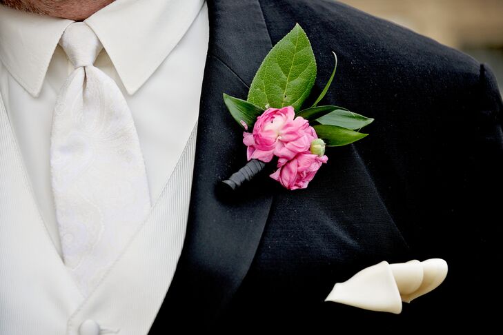 While Matthew’s wedding day look had a classic vibe, he incorporated a subtle nod to the day’s bright and bold theme with the addition of a pink ranunculus boutonniere. And to tie the look together, he added a polished ivory pocket square.