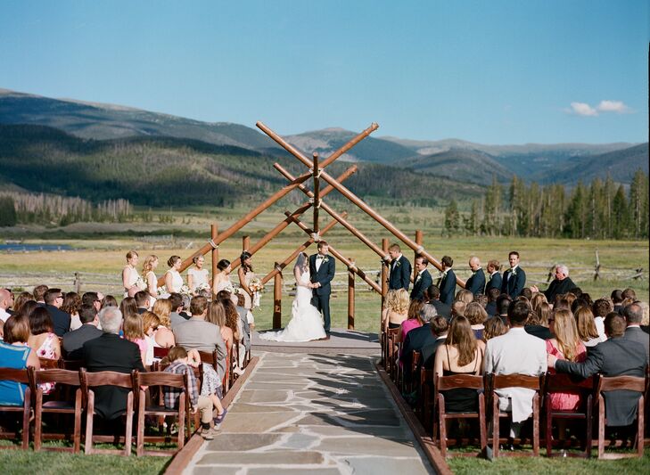 Nicole and Alex's outdoor wedding ceremony was held beneath a rustic timber arch at Devil's Thumb Ranch. “We went back and forth on how we wanted to decorate the ceremony site,” says Nicole. “We ultimately decided that we didn't need any decorations at all, the view of the mountains and the ranch is spectacular enough.”