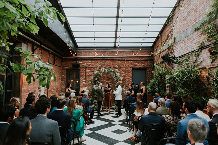 Grooms Marry in Industrial NYC With Exposed Brick, Climbing Vines and String Lights