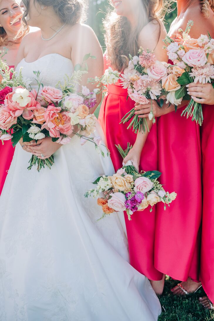 Bride and Bridesmaids in Bright Pink Dresses With Summery Blush, White and Purple Bouquets