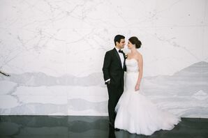 Bride and Groom in Front of Marble Wall
