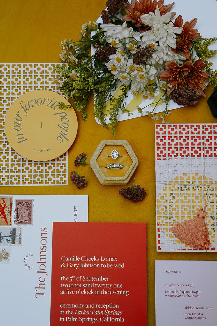 A modern, color-blocked invitation suite with contemporary font and design with paper inspired by an ornate, recognizable wall at the venue (The Parker Palm Spring) with tassels, canary yellow and orange-red details.