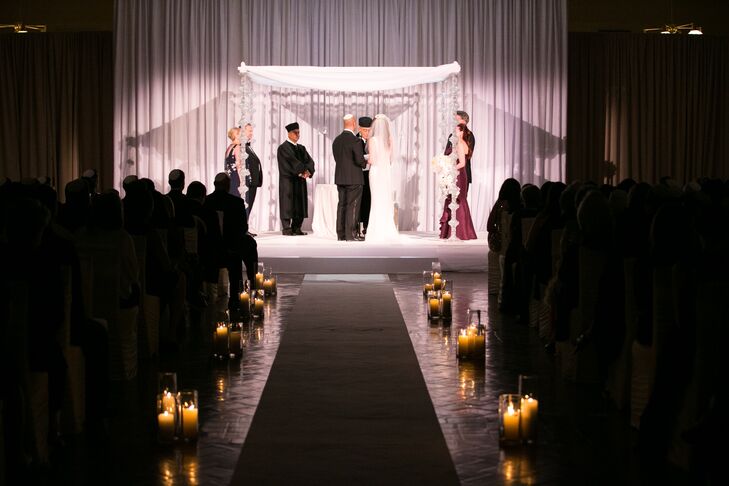 Since Lauren and David are both Jewish, the couple opted for a traditional ceremony. The couple exchanged vows under a crystal-draped chuppah and paid tribute to David’s family's heritage by incorporating a number of Sephardic customs into the proceedings. “The date of our ceremony was also special because it was my grandparents’ anniversary,” Lauren says. My grandfather passed away just a few months before I met David, so he never had the chance to watch me walk down the aisle, but by sharing the same wedding date and knowing that he and my grandmother experienced the same rituals we did, I was able to feel connected to him.”