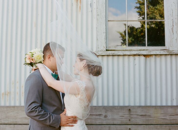Caitlin wore her hair in a loose chignon with a classic veil tucked into the curls.