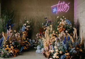 Ceremony Backdrop With Blue Hydrangeas and Neon Sign
