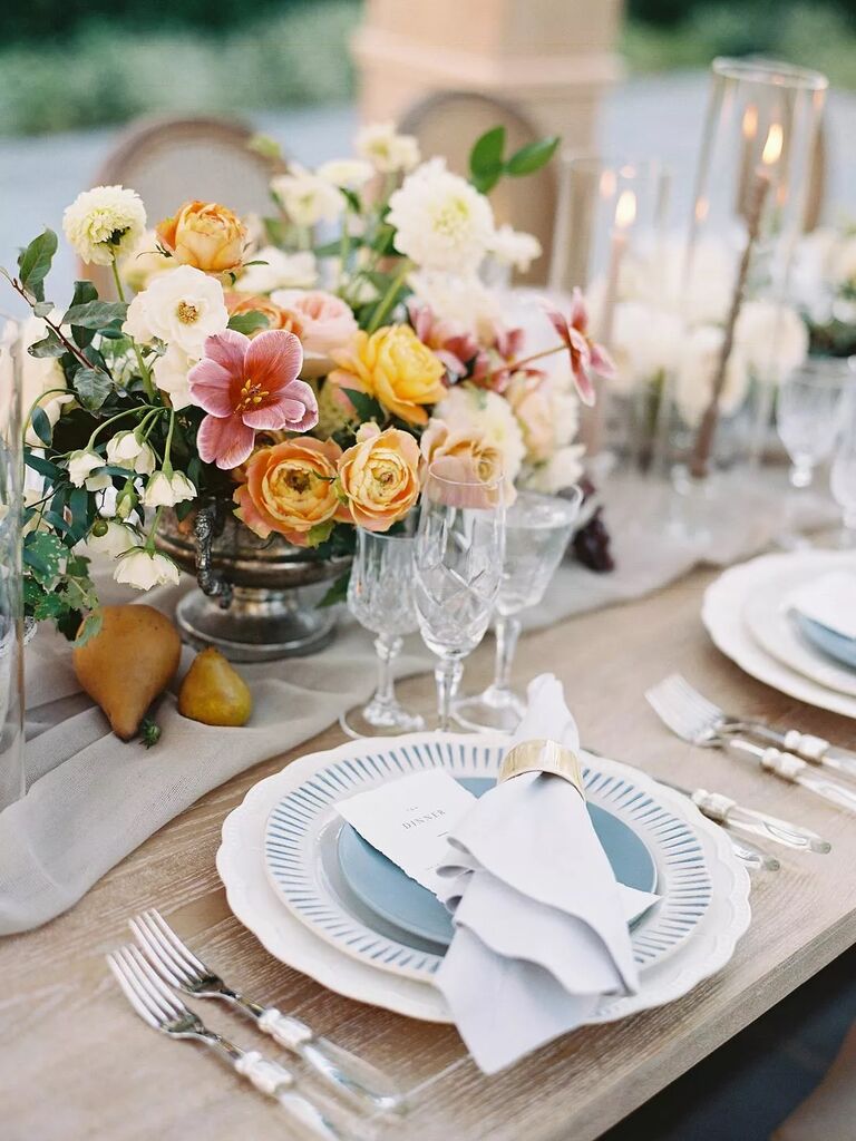Delicate blue and white place settings at a wedding reception