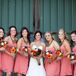 Bridesmaids wore strapless chifon gowns in coral while the bride wore a sweetheart cut Faviana gown.