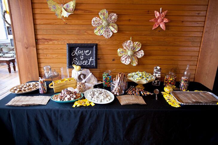 The Candy table was in honor of the bride’s daughter, Sailor, and was decorated with paper flowers and butterflies with various candies and homemade treats with guests to take home.