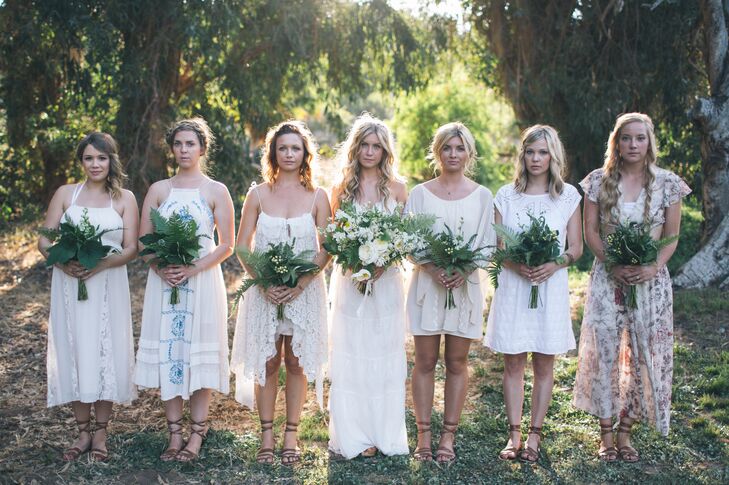 Rebekah's six bridesmaids wore their own white or ivory dresses. Greek-style sandals gave them a cohesive look.