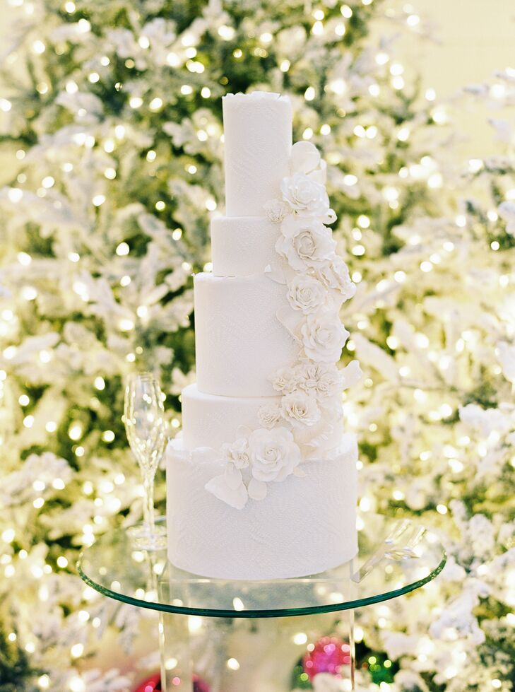 Textured, Five-Tier White Cake With Cascading Flowers for Christmas Wedding