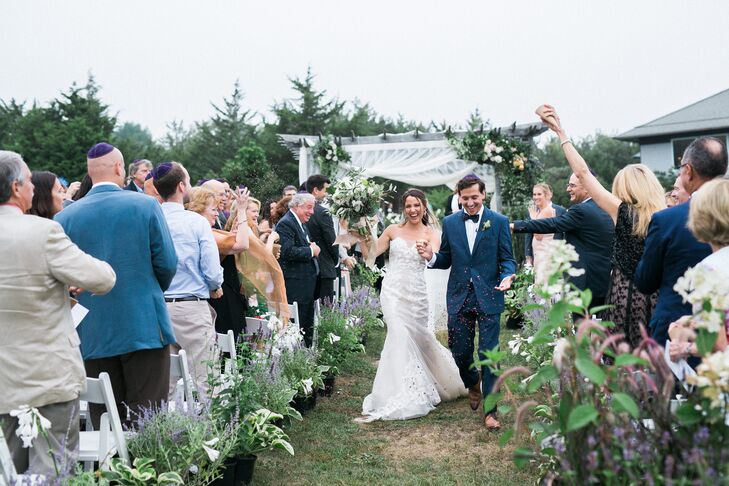 Guests Showering Couple with Dried Herbs and Flowers