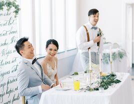 Bride and groom laughing during wedding toast