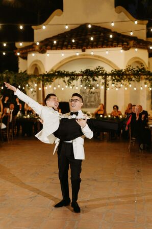 Grooms in Matching White Tux Jackets Performing Their First Dance With a Lift