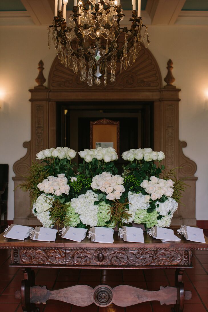The ceremony programs were designed to echo the romantic theme of the wedding and were displayed with lush floral arrangements for guests to have something to look while waiting for the ceremony to begin.