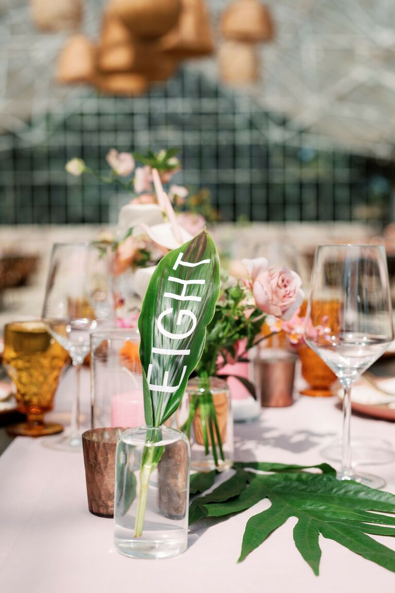 Tropical leaf table number as part of boho tablescape