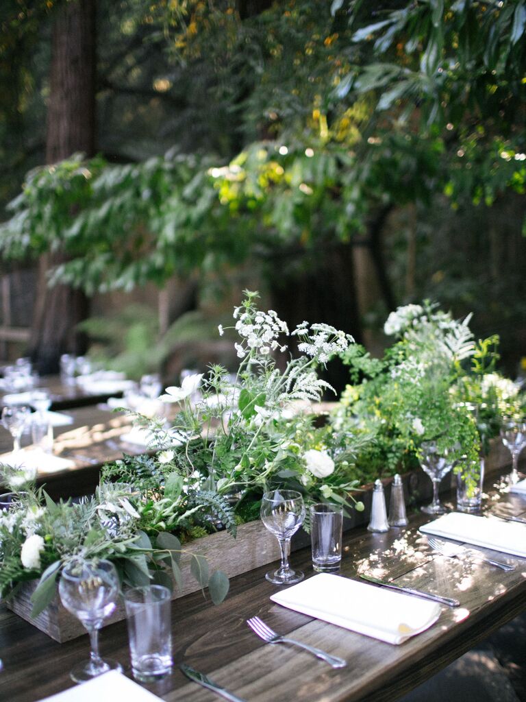 whimsical wedding centerpiece with queen anne's lace and greenery in galvanized tin vessel