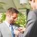 Groomsman Fastens Boutonniere