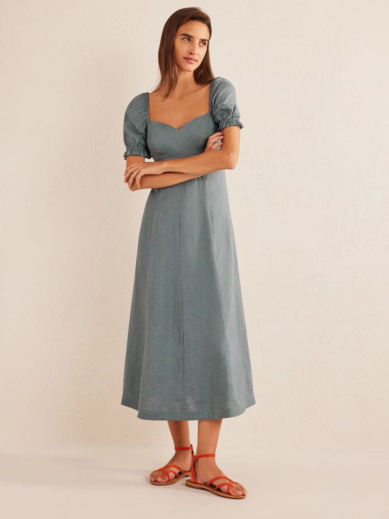 A model shows off this calf-length engagement gown.