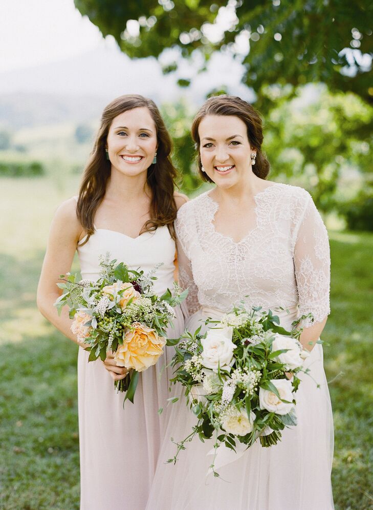 Augusta carried an unfussy bunch of garden roses, dahlias, white sumac, herbs, scabiosa, green viburnum berries and passion flower vine. The bridesmaids carried similar bouquets with a touch of color.