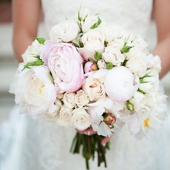 Sara Beth carried a traditional white rose bouquet light pink peonies to add contrast.