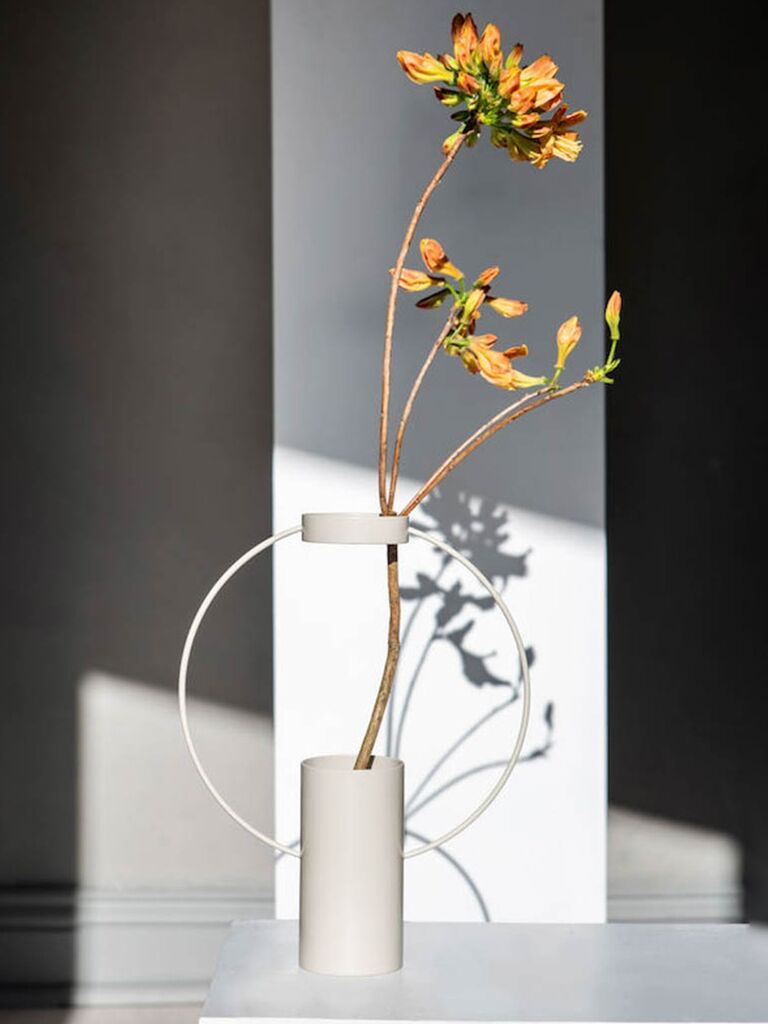 Contemporary white vase wedding gift idea pictured with flowers