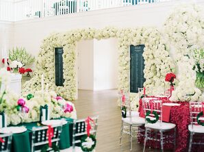 Christmas Wedding Reception Entrance With Flower Wall and Bold Colors