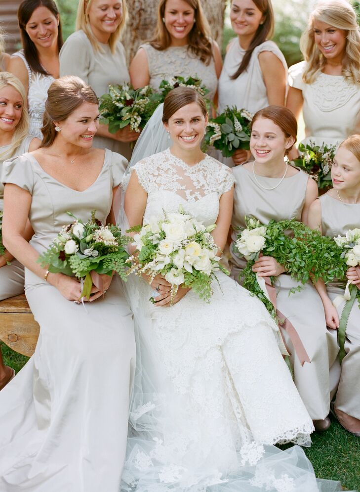 The bride channeled an elegant look thanks to a custom-made lace gown with a tiered skirt and cap-sleeve detail.