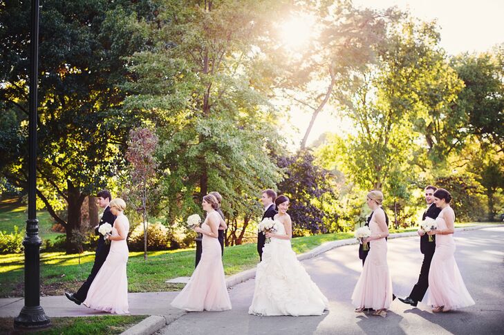 The bridesmaids wore blush Monique Lhuillier floor-length dresses while the groomsmen wore classic black tuxedos with bow ties.