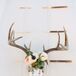 Dinner was served out of individual tepees adorned with English mounts of deer skills and a gorgeous floral design.