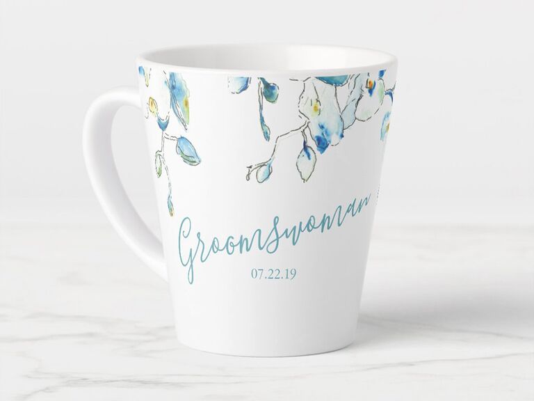White mug with blue watercolor orchid design and 'Groomswoman' in loopy script