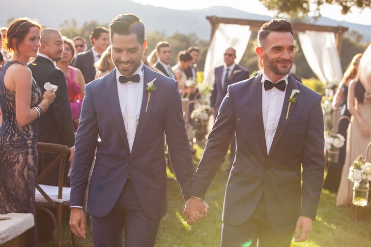 "Being a gay couple makes the choice of attire difficult," Renato says. "We wanted to match but not be the same. We wanted it to be a modern tuxedo, and we wanted it to go well with the palette we chose." Renato and Patrick chose Ermenegildo Zegna tuxedos in contrasting (but complementary) blue hues.