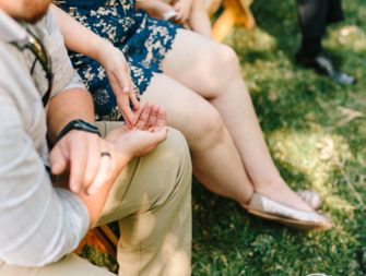 Couple holding wedding rings