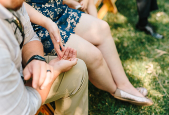 Couple holding wedding rings