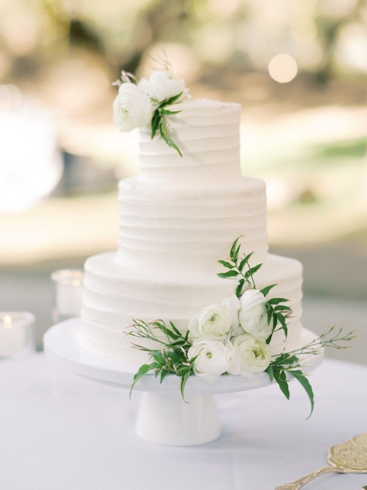 simple three-tier white-and-green spring wedding cake