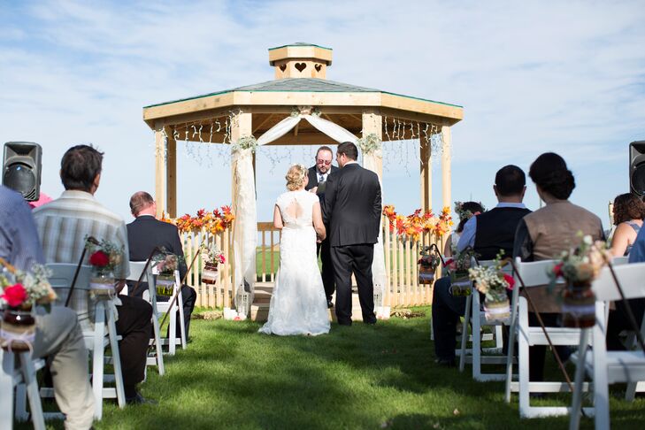 Talia and Casey's fall wedding featured a lot of elements reflective of the fall season in the country. "I wanted to work with a color palette of brown, peach and off-white with a little blue thrown in," Talia says. "I thought it would complement the country wedding we were having, with lots of lace and burlap."