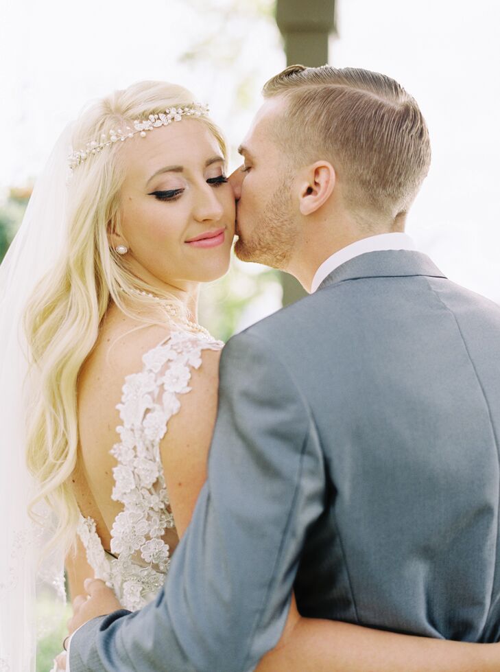 Lauren wore a pearly headband to accent the pearls on her wedding dress for a boho bridal look. She also wore a waist length veil.