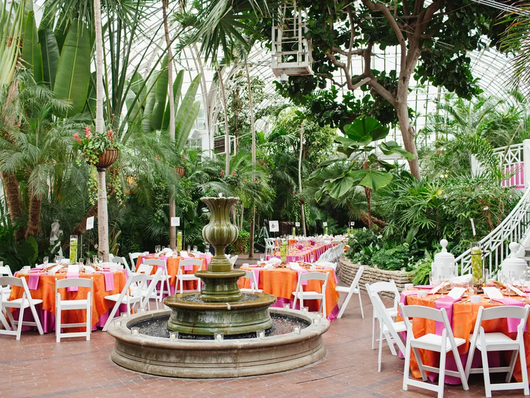 The tables are set for an outdoor wedding reception at Franklin Park Conservatory and Botanical Gardens in Columbus, Ohio