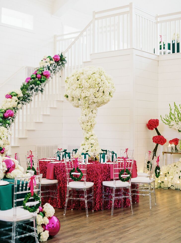Christmas Wedding Reception With Fuchsia Table Linen and Towering Centerpiece