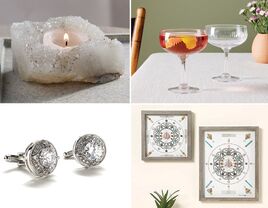 Four crystal anniversary gifts: a candle holder, two cocktail glasses, crystal wall art, and cuff links