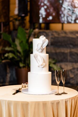 Simple All-White Wedding Cake With Sculptural Accents