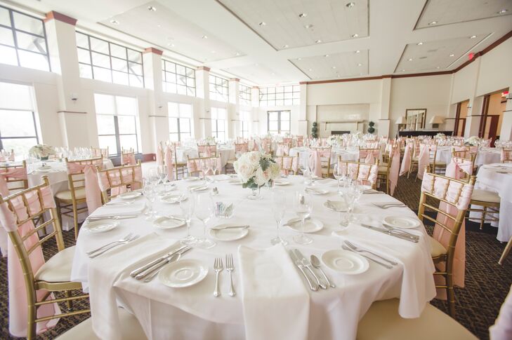 White linens, gold chiavari chairs and blush accents kept the light-filled reception room feeling airy and elegant.