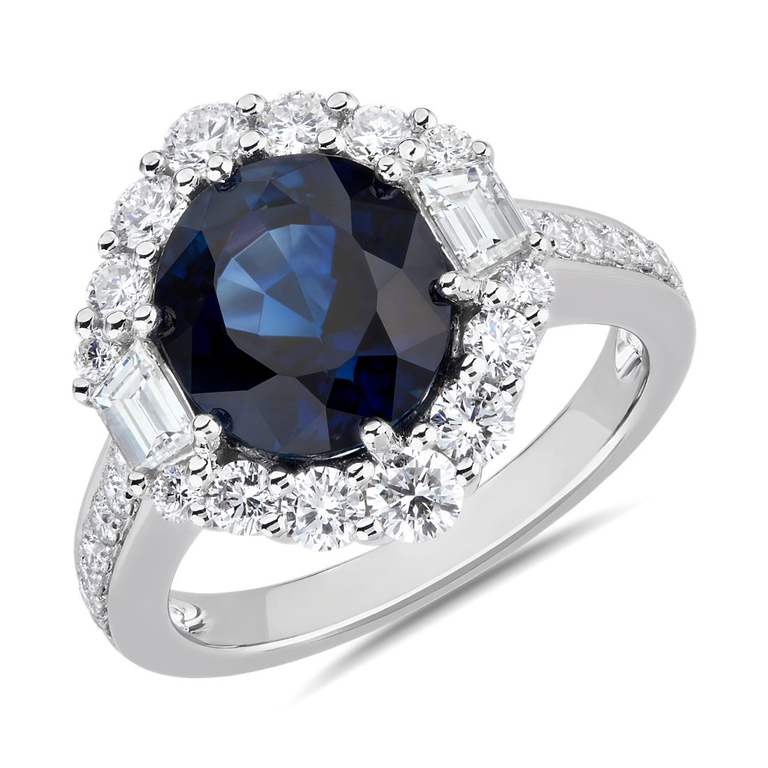A round sapphire flanked by diamonds.