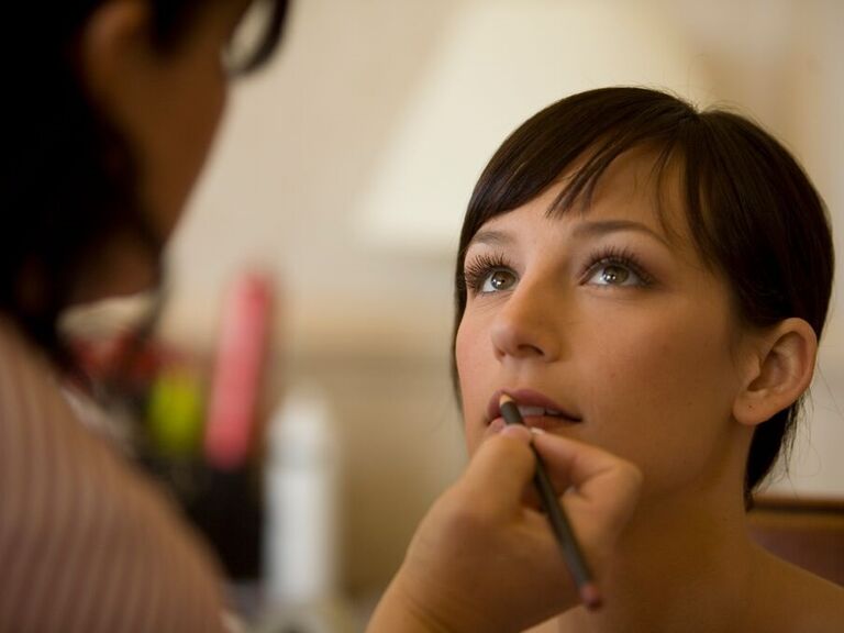 Bride gets her wedding hair and makeup done by Camposecco Artistry. 