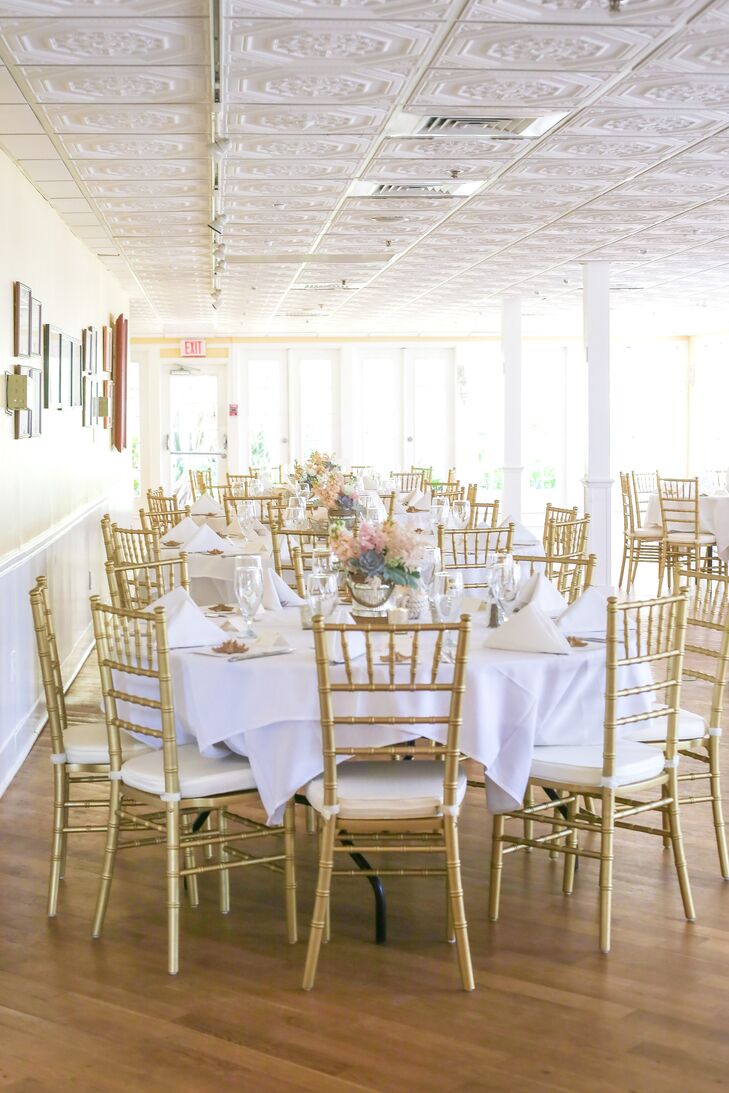 Wanting to accent the ‘Tween Waters Inn Island Resort’s bright buildings with a softer palette, Lindsey and George decorated their reception with gold chiavari chairs, white linens and lush low centerpieces. Each arrangement had a soft display of blush, white and green flowers.