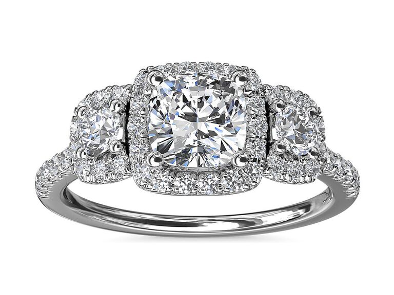 blue nile diamond three stone cushion cut engagement ring with two side diamonds all with round diamond halos and round diamond band